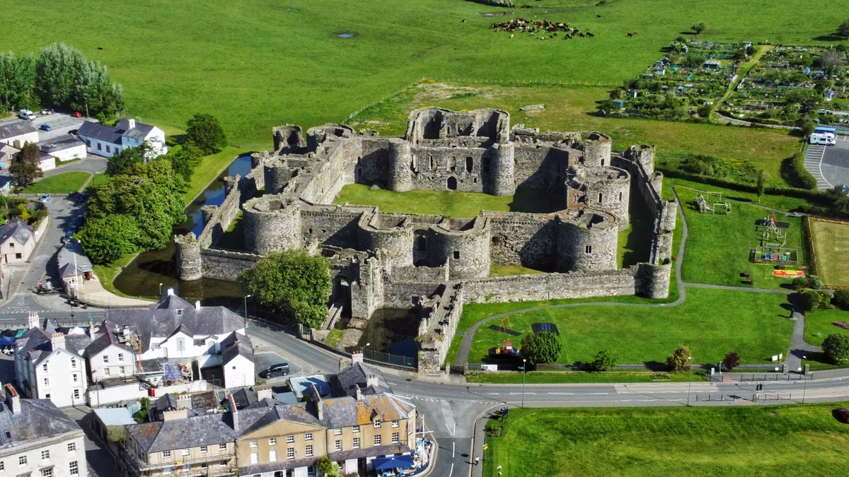 Aerial view of Beaumaris Castle showing concentric defensive walls and the kill zones between inner and outer rings